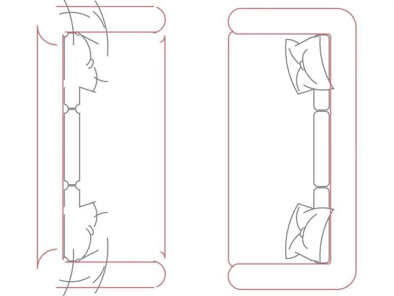 Plan-view CAD block of two facing sofas with loose cushions and throws
