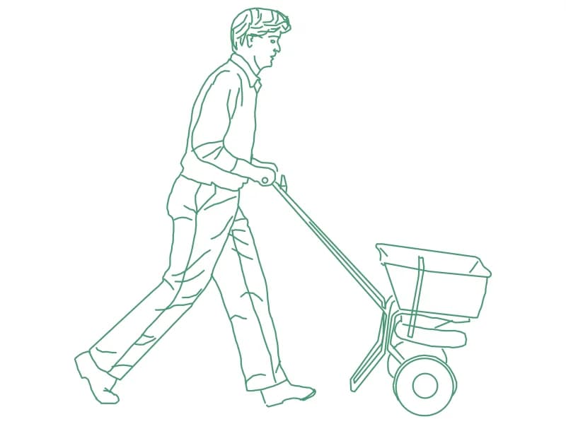 CAD block of a man pushing a two-wheeled garden spreader in side elevation
